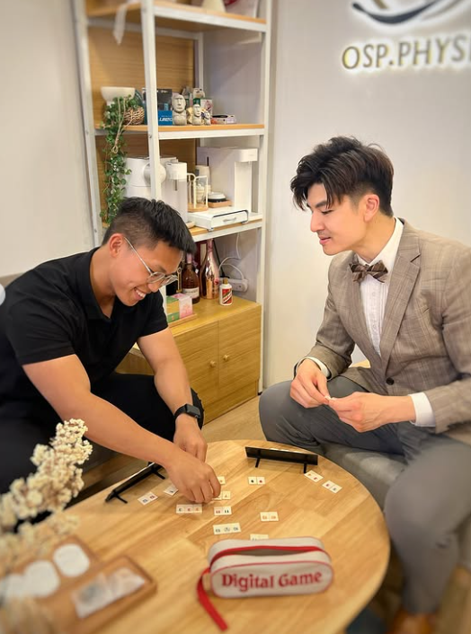 Matthew and Gerald playing a board game at OSP — mentorship and brotherhood